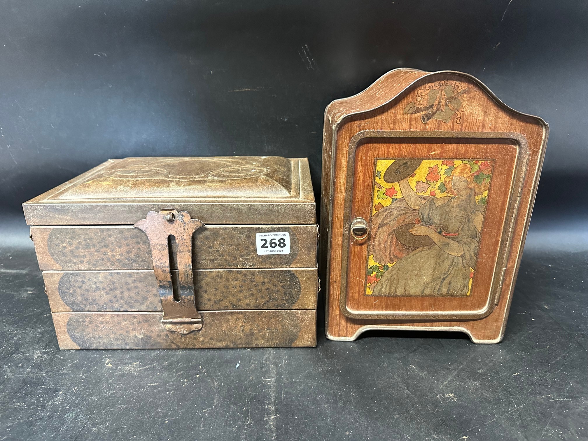 A biscuit tin with integral shelf and Arts and Crafts designs to front and a C.W.S Crumpsall