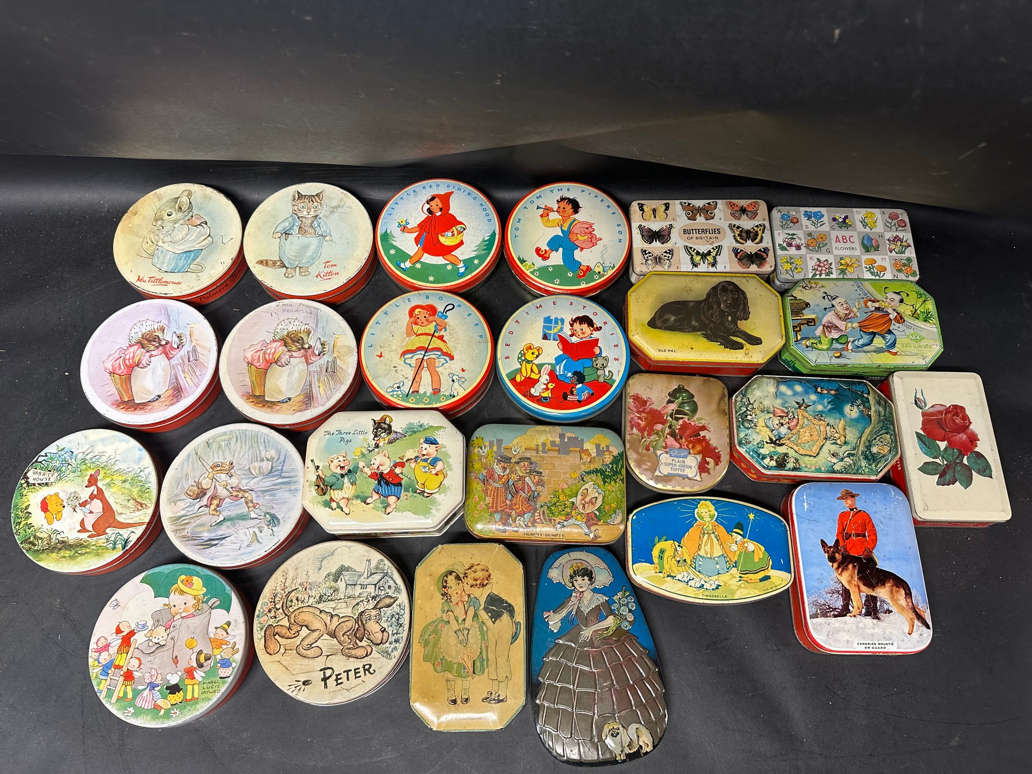 A selection of toffee and sweetie tins inc. Bluebird Toffee, Huntley & Palmers, Mabel Lucie Attwell,