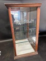 A display case etched Scribbans & Co's Rich Cakes to either side, with two glass shelves and rear