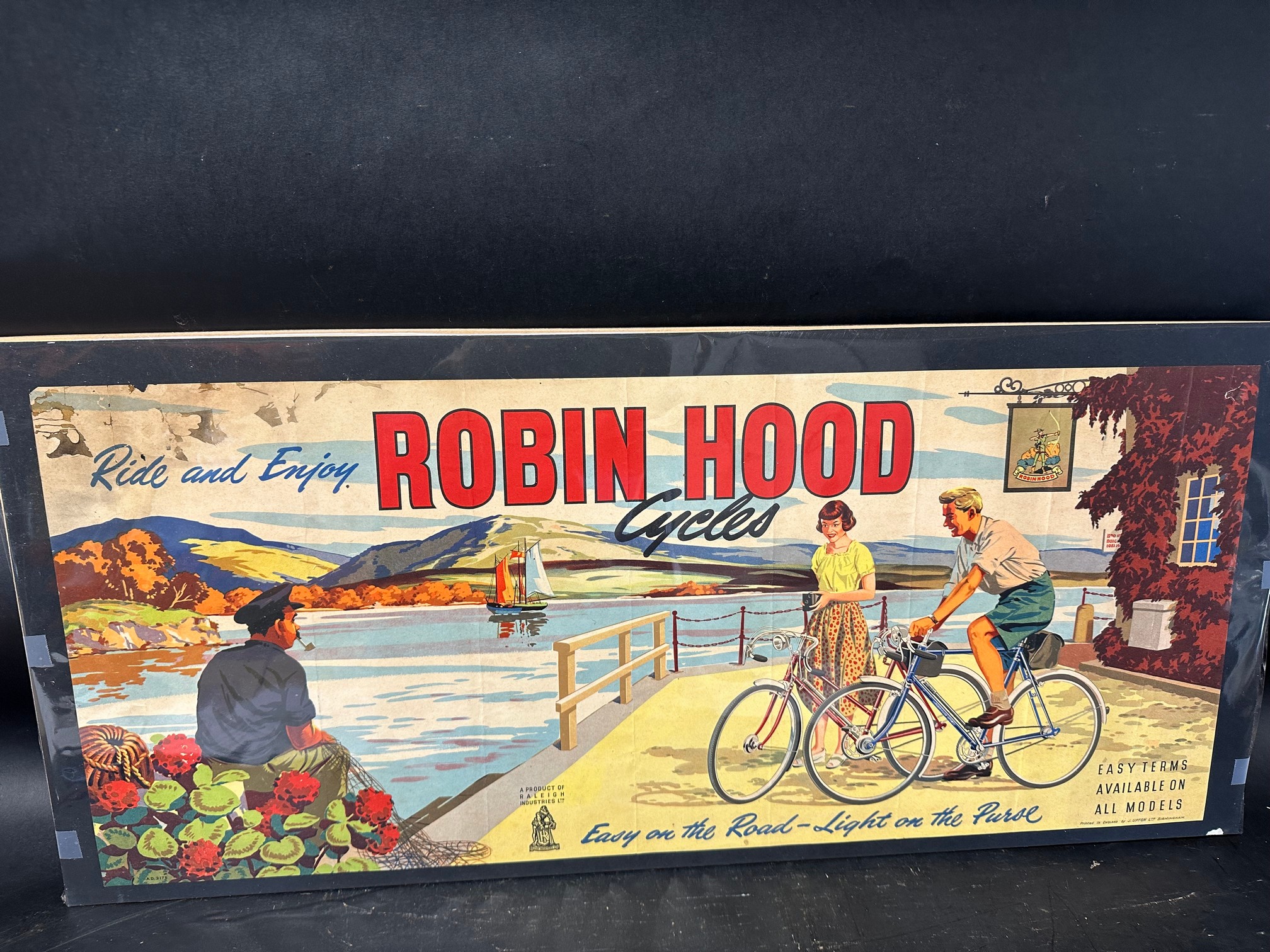A poster advertising Robin Hood Cycles 'Easy on Road - Light on the Purse', a product of Raleigh