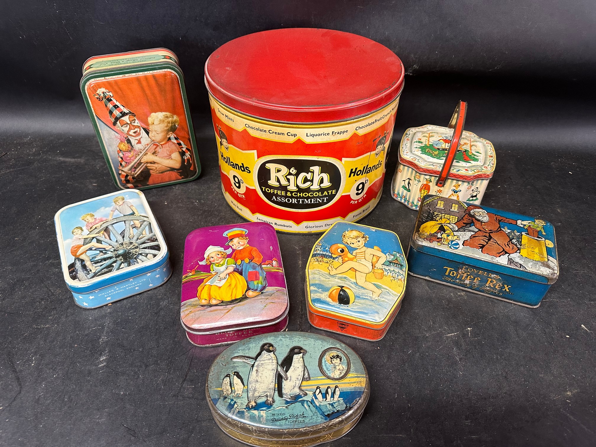 A large 1950s Hollands Rich Toffee & Chocolate Assortment tin, 9" diameter plus seven assorted