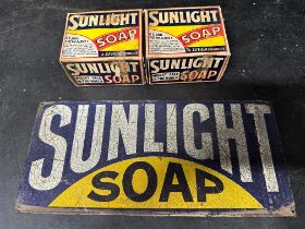 A Sunlight Soap tin sign, 10 x 4 1/2" with two Sunlight Soap boxes.