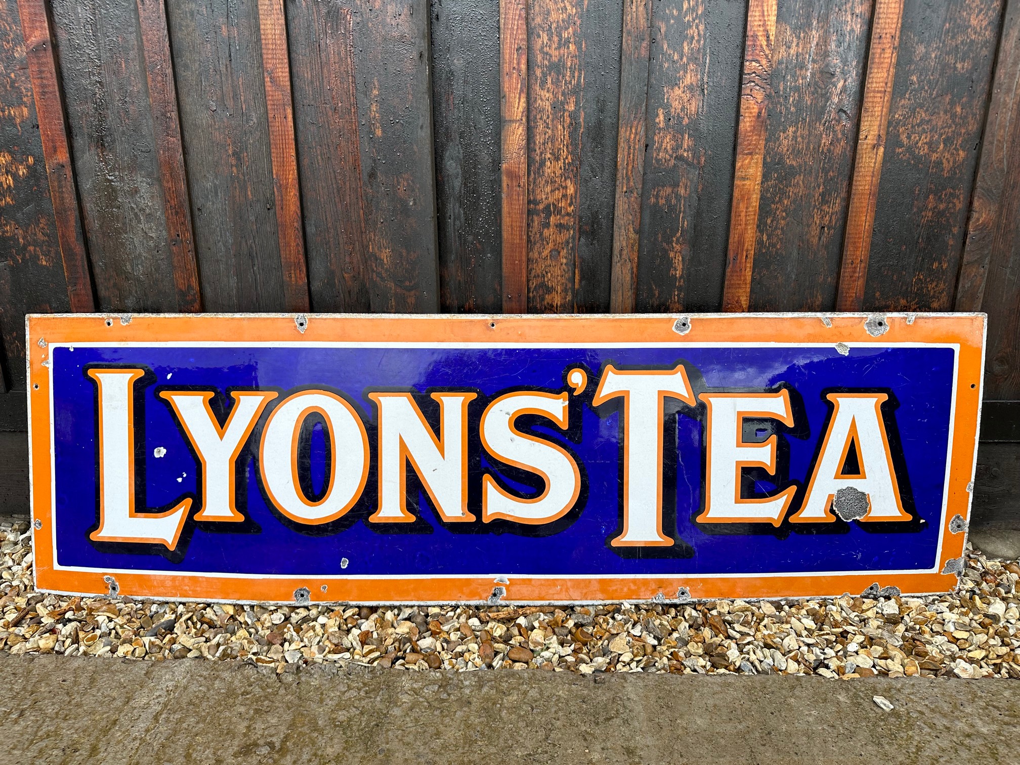 A Lyons' Tea enamel advertising sign, 60 x 18 1/4".