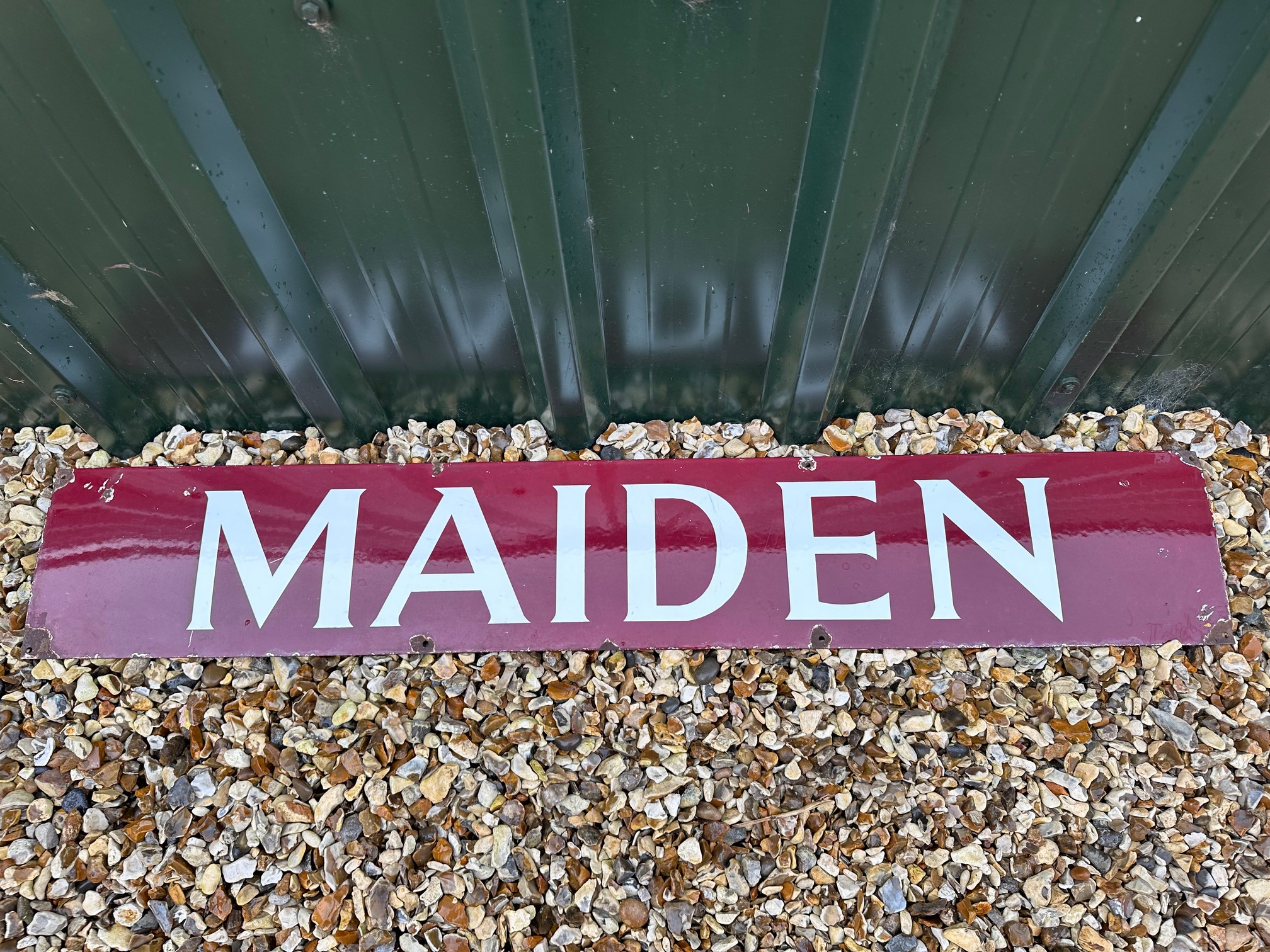 A Maiden enamel railway sign, 48 x 8".