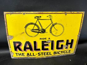 A Raleigh enamel advertising sign with illustration of bicycle, 'Ride a Raleigh the All-Steel