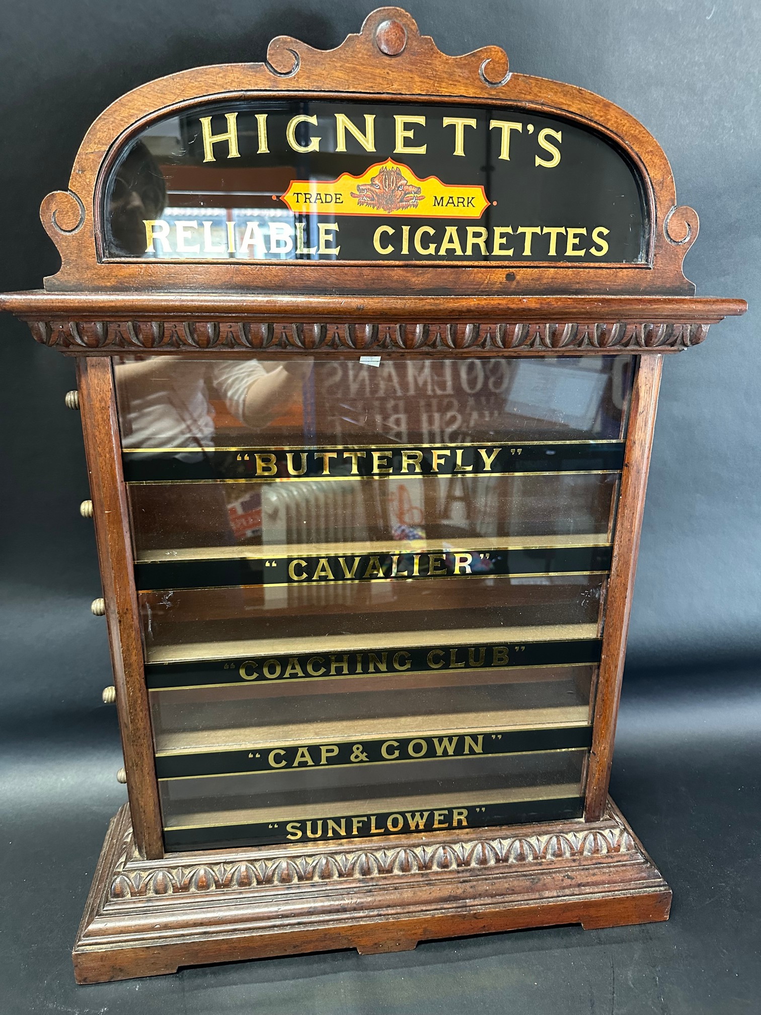 A Hignett's Cigarettes pediment five drawer cabinet, 30" tall x 22" wide x 6/3" deep.