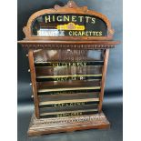 A Hignett's Cigarettes pediment five drawer cabinet, 30" tall x 22" wide x 6/3" deep.