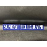 A Sunday Telegraph enamel advertising sign, 22 1/2 x 3 1/2".