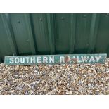 A Southern Railway enamel advertising sign, 52 x 5" by repute from Basingstoke Station.