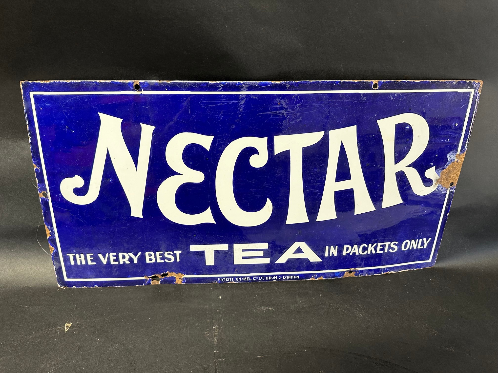 A Nectar Tea enamel advertising sign by Patent Enamel Co. Ltd. 24 x 12".