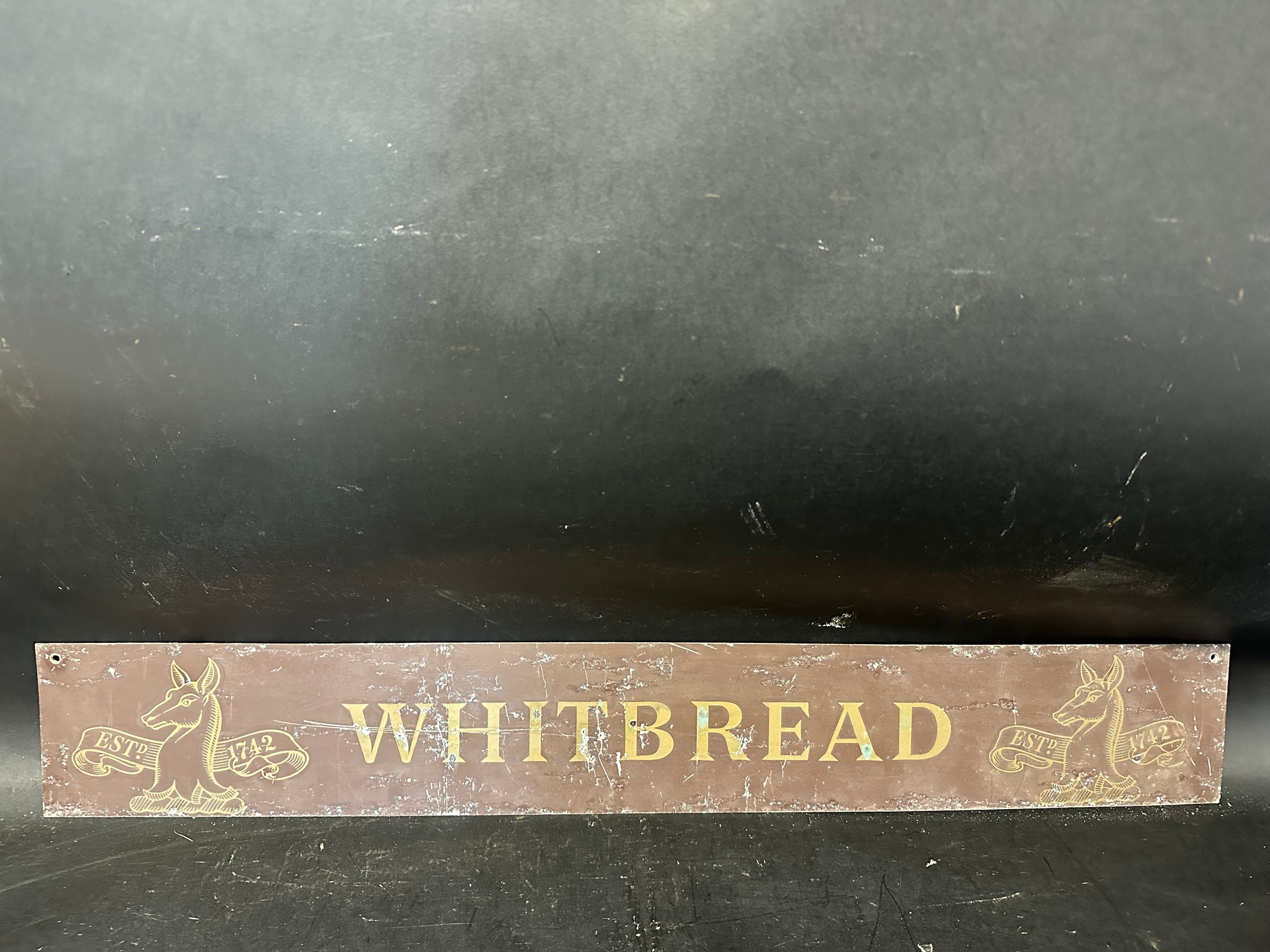 A Whitbread metal advertisement, 36 x 5 1/4".