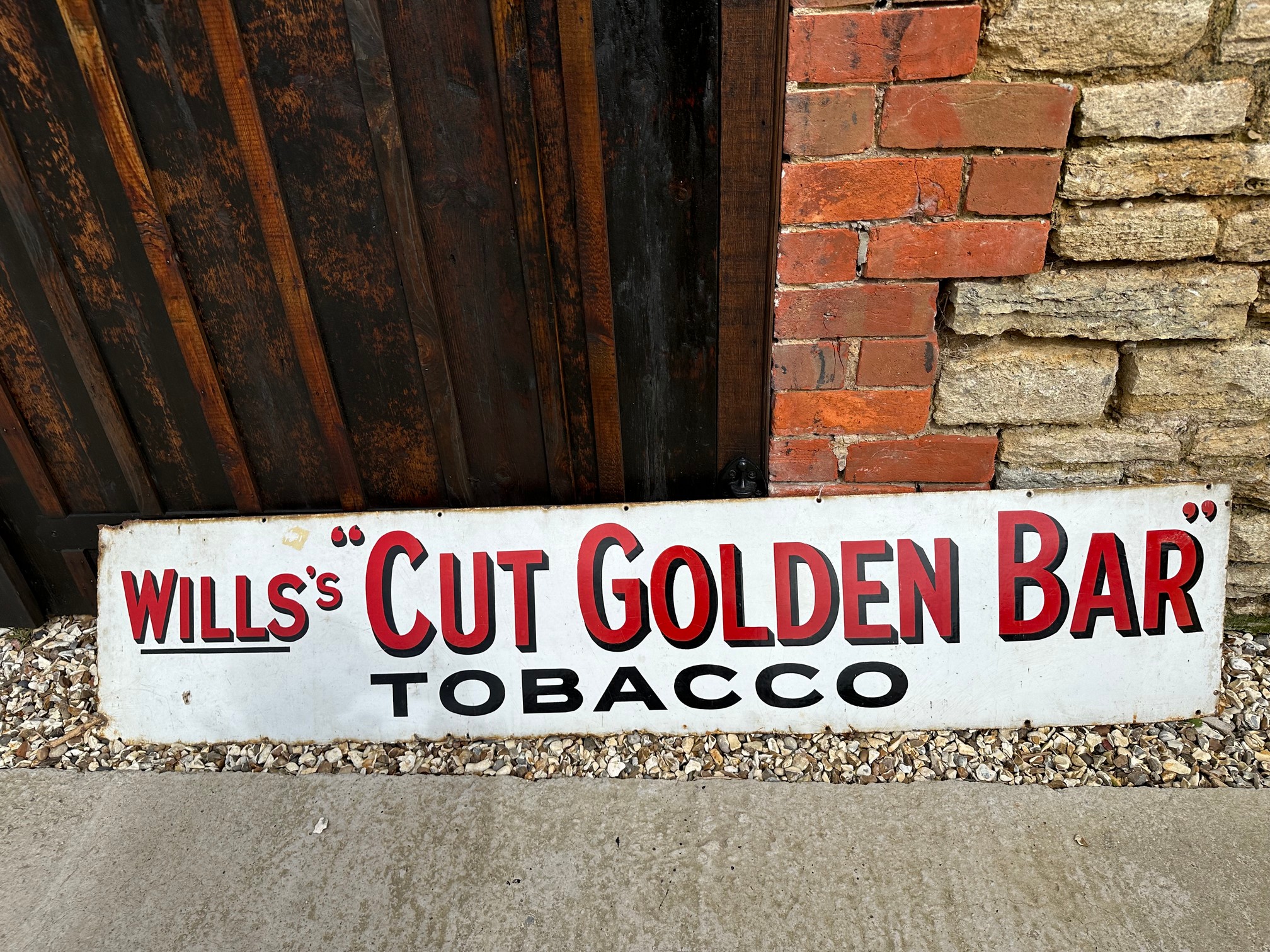 A Wills's "Cut Golden Bar" Tobacco enamel advertising sign, 72 x 15".