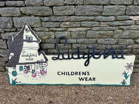 A 1950s Ladybird Childrenswear boarded hanging advertising sign, 72 x 36"