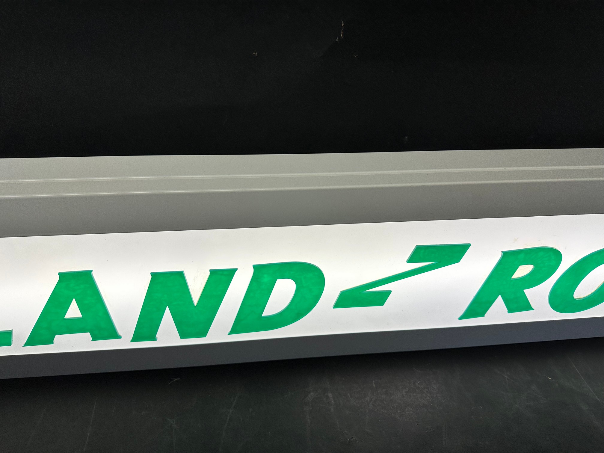 A hanging lightbox with Land Rover applied in acrylic letters, 47 1/4 x 9 x 2 3/4". - Image 3 of 5