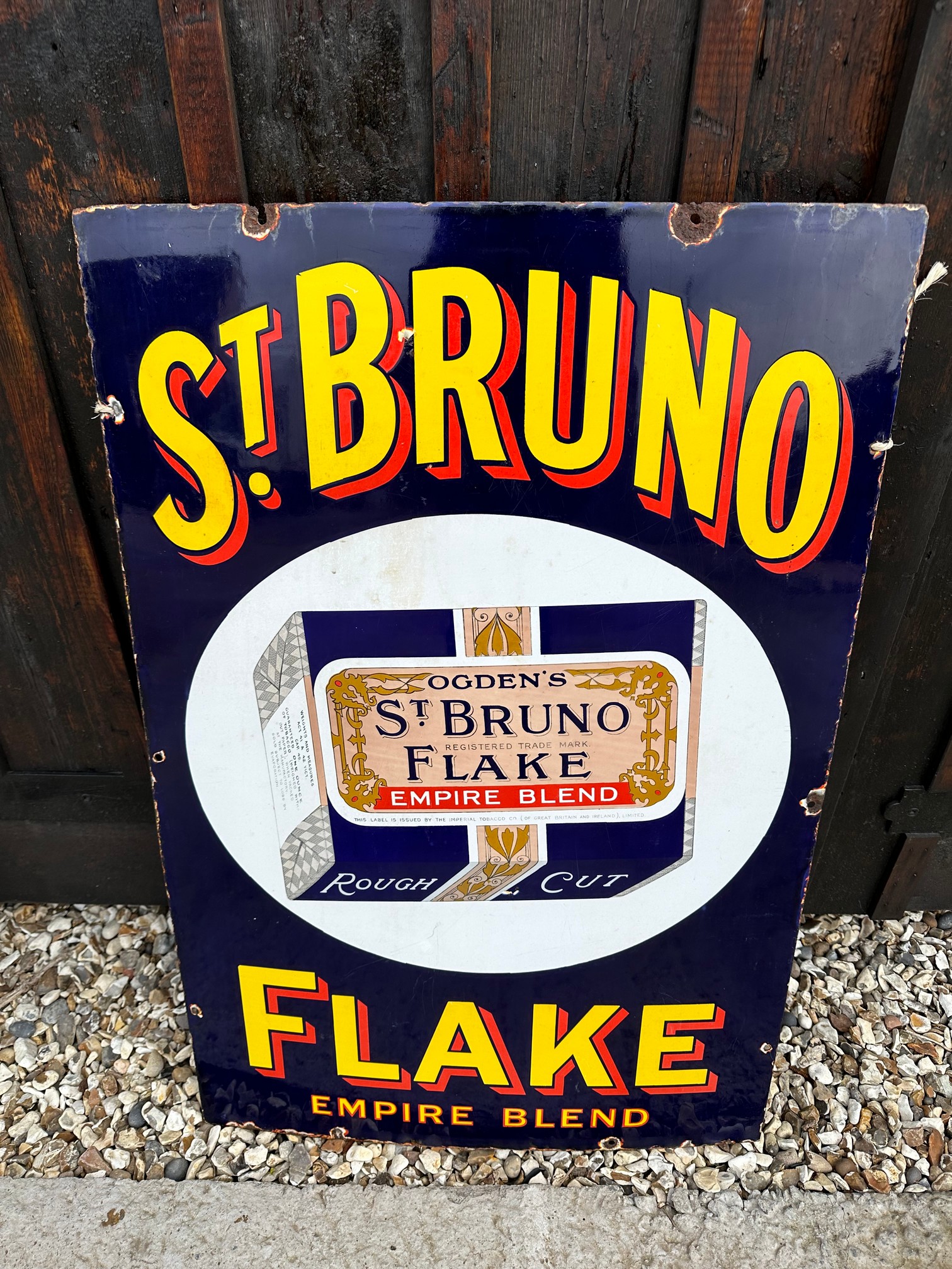 An Ogden's St. Bruno Flake pictorial enamel advertising sign in good condition, 24 x 36".