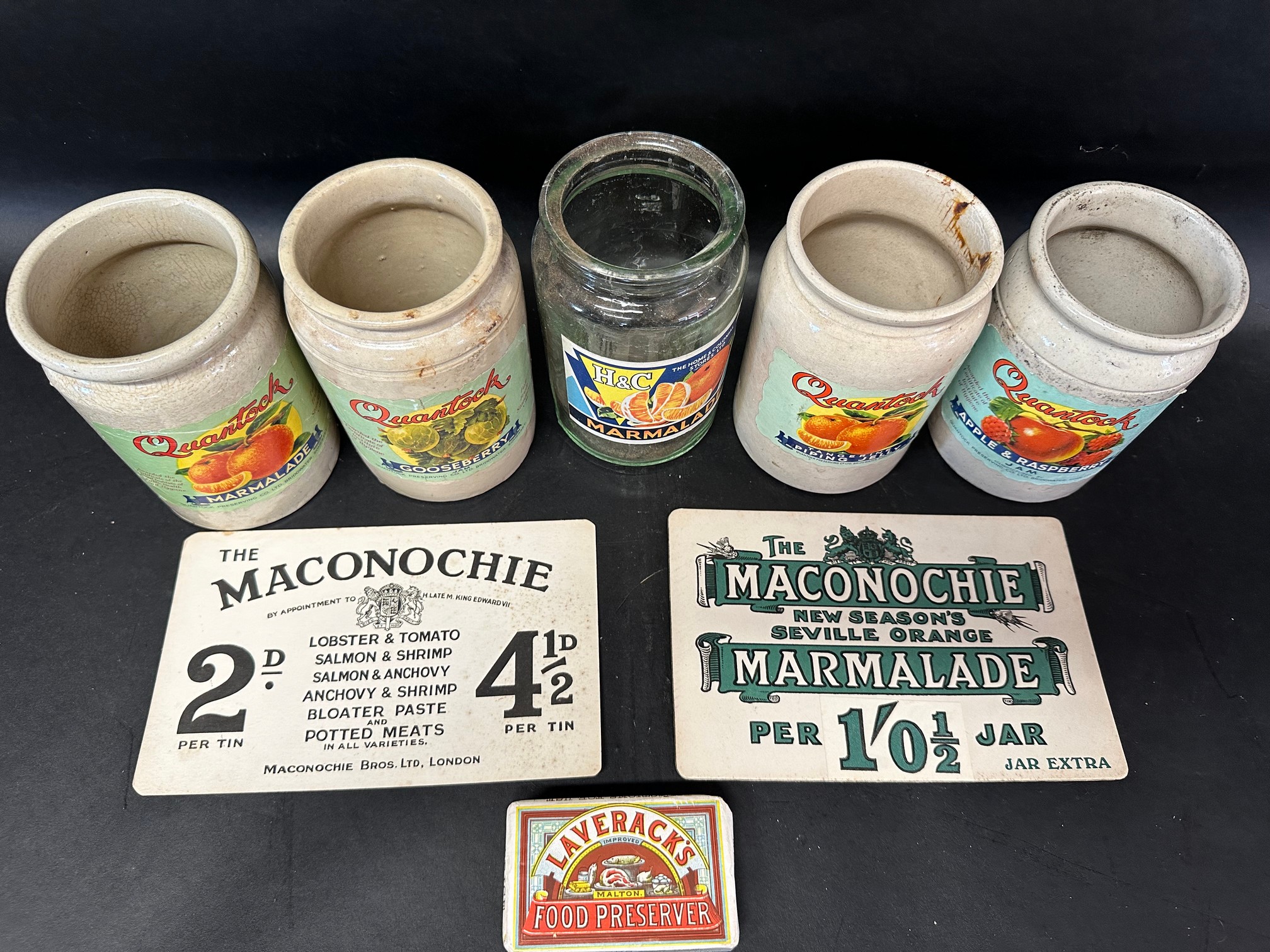 A Laverick's dummy bar, two Maconochie price cards, and five preserve jars.