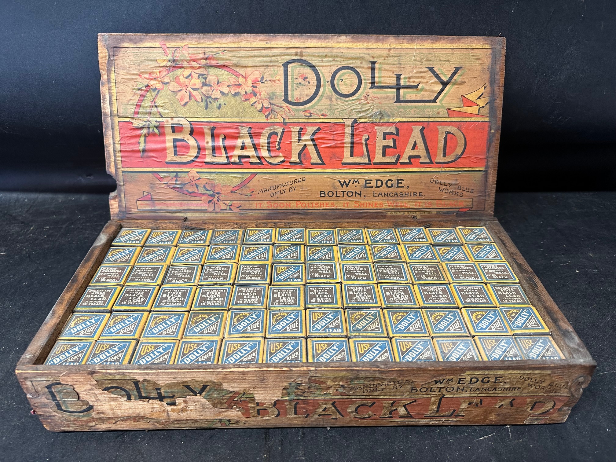 A Dolly Black Lead polish wooden counter top dispensing crate with full contents, manufactured by