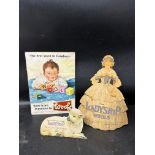 Three advertisements for British wool: a rectangular showcard depicting a child dressed in wool