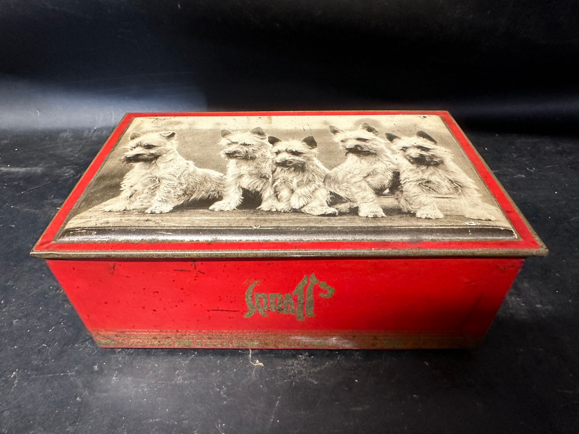 A Spratts terrier puppies advertising tin, 8" wide.