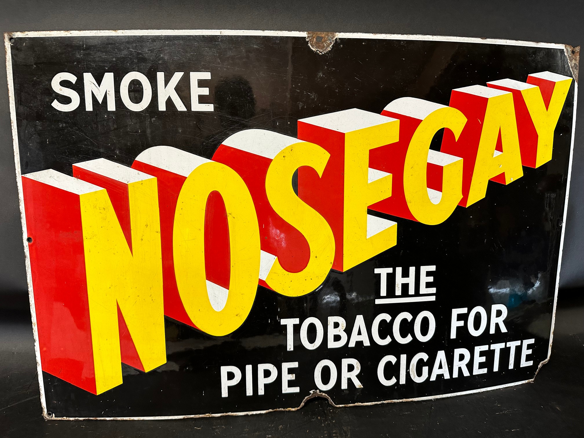 A 'Smoke Nosegay the Tobacco for Pipe or Cigarette' graphic enamel advertising sign, 30 x 20".