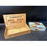 A Cadbury's Nut Milk Chocolate wooden counter top dispensing box and a Cadbury's "Welfare"