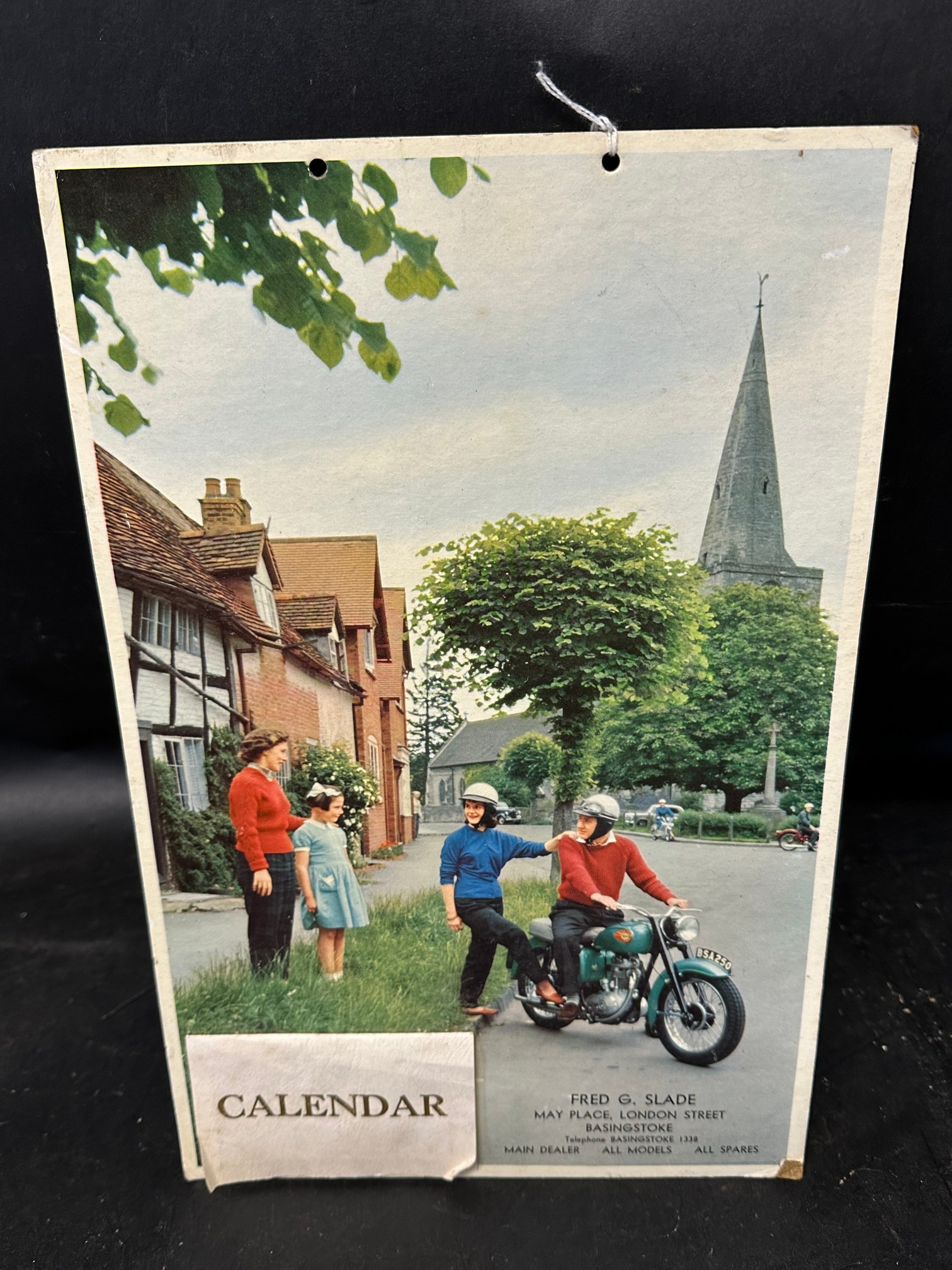 A 1967 calendar depicting a couple on a BSA motorcycle advertising F.G. Slade dealership of