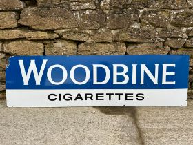 A Woodbine Cigarettes enamel advertising sign, 60 x 17 1/4".