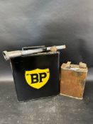 A Continental fuel can with funnel, BP cap and contemporary sticker and an oil can.
