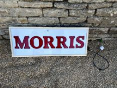 A garage dealership lightbox advertising Morris cars with chamfered edge and traces of gold colour