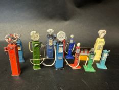 A selection of playworn models of petrol pumps etc, some stamped Dinky.