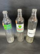 Three glass quart oil bottles: 2 x BP Energol and a Service Oil.