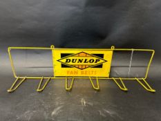 A Dunlop Fan Belts wall mounted rack.