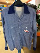 An Esso forecourt attendant's shirt with Esso patches to front and back and pocket to right side.