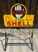 A Shell Spirit and Shell Oils double sided enamel advertising sign set in garage forecourt stand,