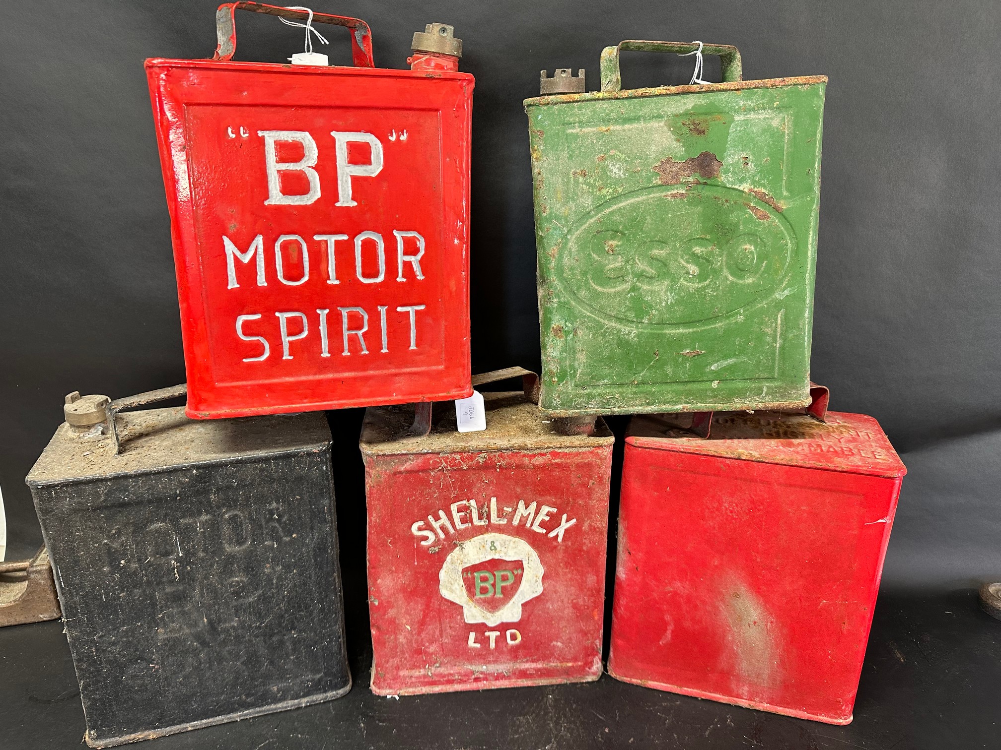 Five two gallon cans: two BP Motor Spirit, an Esso, a Shell-Mex Ltd ...