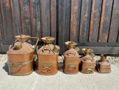 Four copper Chekpump pourers (1, 2, 4 and 5 gallons) - the smaller marked London, the other three