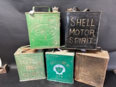 Five two gallon cans: Esso, Shell Motor Spirit, BP Motor Spirit, Shell-Mex and a plain, various lids