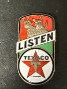 A Texaco enamel badge depicting two Scottie dogs by Butler, Vittoria St. Birmingham, 1 3/4