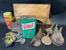 An autojumbler's lot - a Dunlop Junior boxed footpump, four AA car badges, various funnels, a BP two