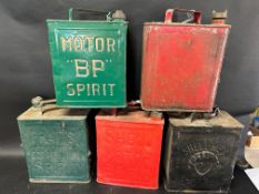 Five two gallon cans: BP Motor Spirit, Shell-Mex, Shell Motor Spirit, Pratts Perfection Spirit and a