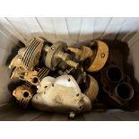 A box of Triumph spares including heads, barrels, cranks etc.