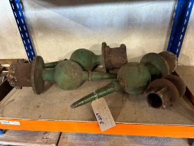 Three large and one small cast iron finial posts.