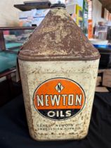 A Newton Oils five gallon pyramid can.