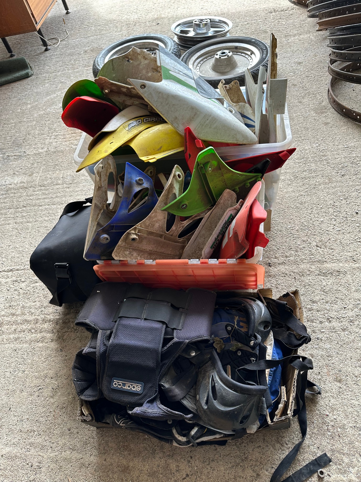 A quantity of used MX motorbike plastic mudguards, number holders, covers and body protectors.