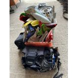 A quantity of used MX motorbike plastic mudguards, number holders, covers and body protectors.