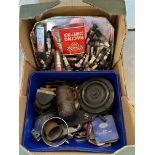 A box of mixed parts including spark plugs, a horn, coils etc.