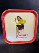 An Offilers' Bottled Bitter tin drinks tray with a stylish lady dressed in 1950s bullet bra
