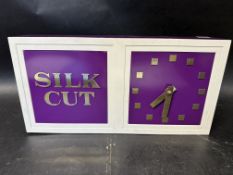 A Silk Cut (cigarettes) wall clock, 14 1/4 x 7 1/4 x 2 3/4