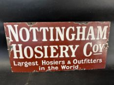 A Nottingham Hosiery Co.y 'Largest Hosiers & Outfitters in the World' enamel advertising sign, 24