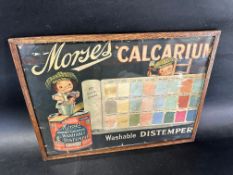 A Morses 'Calcarium' distemper 60 shade paint chart depicting one cherub character mixing paint
